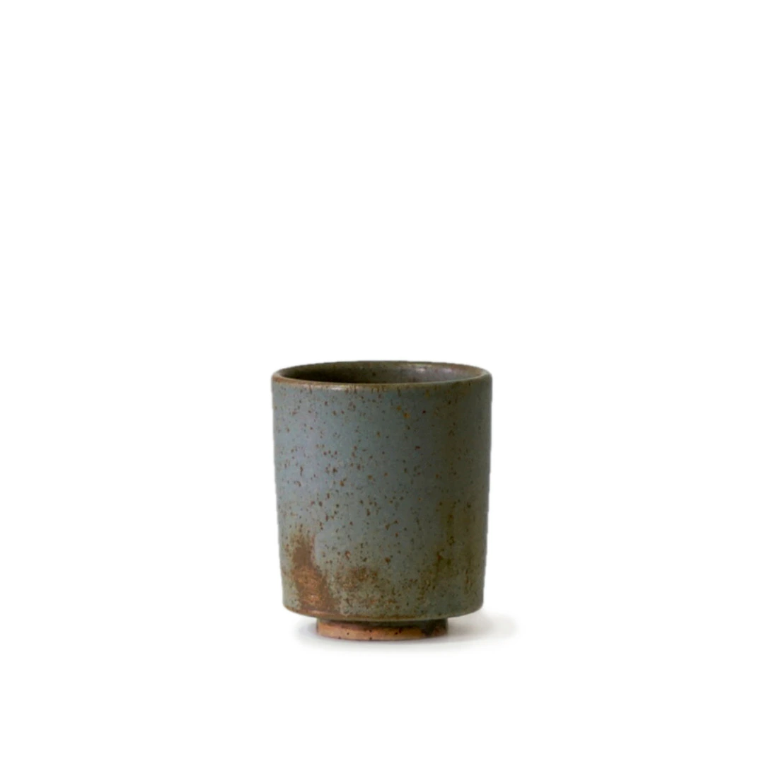 Small gray-blue stoneware Horizon Blue Ceramic Tumbler on a white background