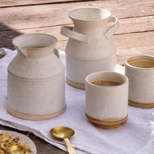 handmade ceramic coffee set with cups jug and tableware on rustic table